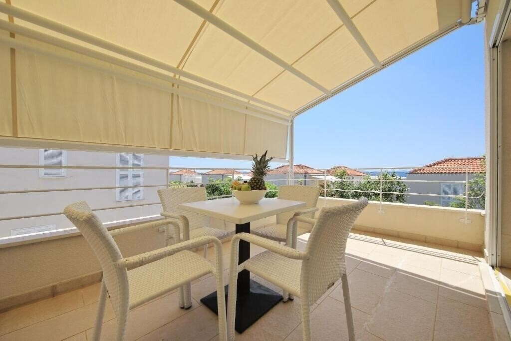 Фотографія Falkensteiner Apartments Petrcane 4*