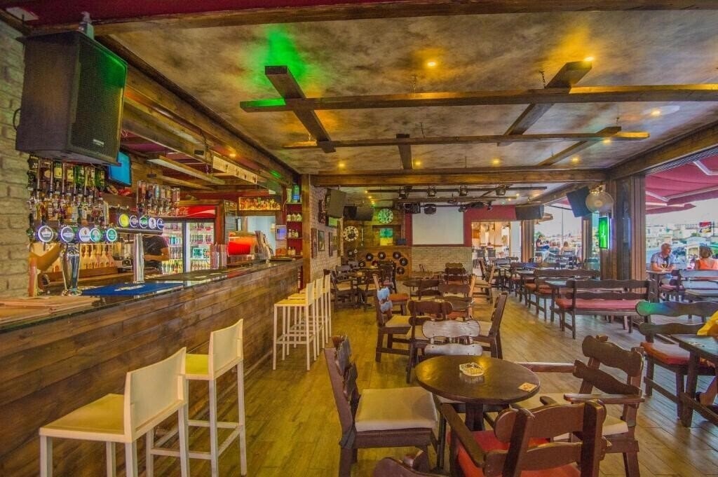 Фотографія Windmills Hotel Apartments 4*