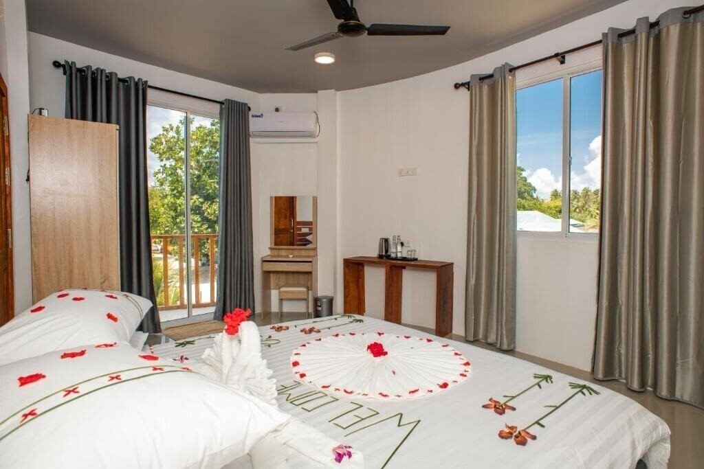 Obraz Finolhu Inn Dhigurah Guest House гостиный двор