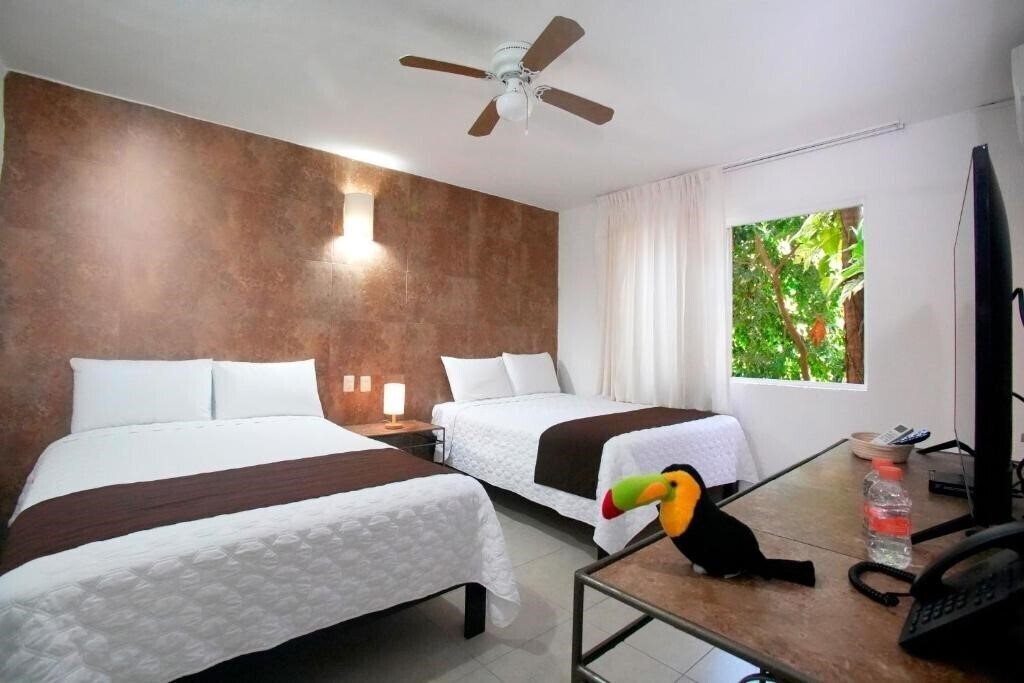 Фото Tukan Hotel Playa Del Carmen 4*
