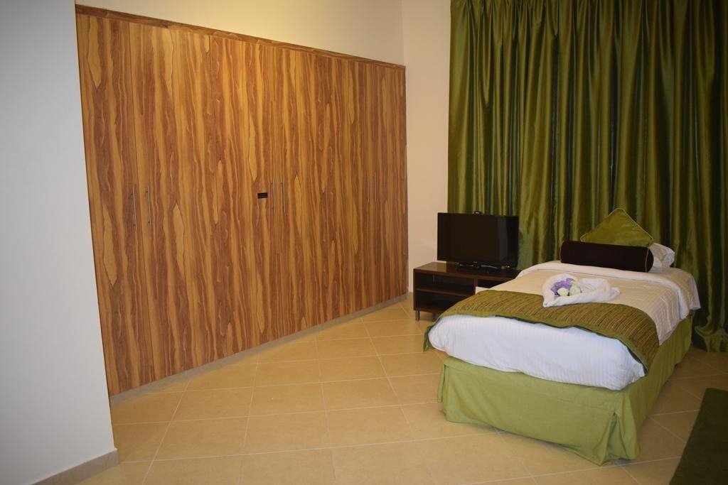 Zdjęcie Al Waleed Holiday Homes - Al Barsha (ex. Al Waleed Palace Hotel Apartments ) 4*