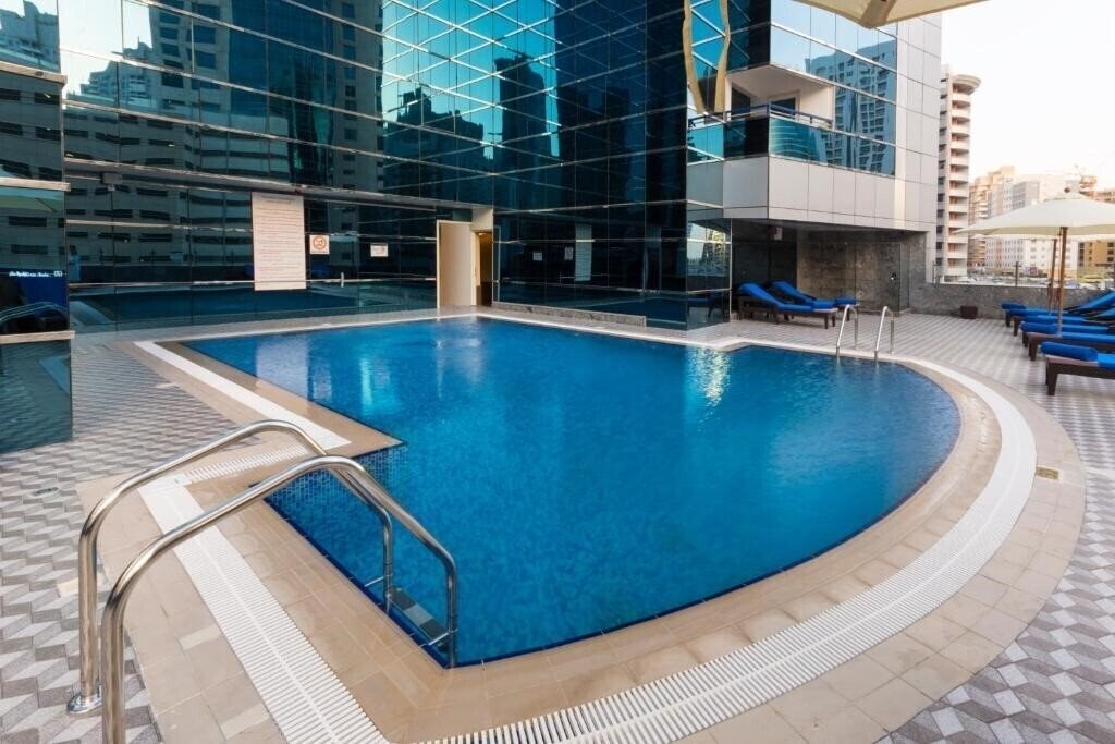 Zdjęcie Golden Tulip Media Hotel (ex. Comfort Inn Hotel Apartments, Golden Tulip Al Thanyah) 4*