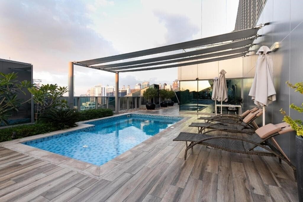 Фотографія Simply Comfort Suites in J One Tower 4*