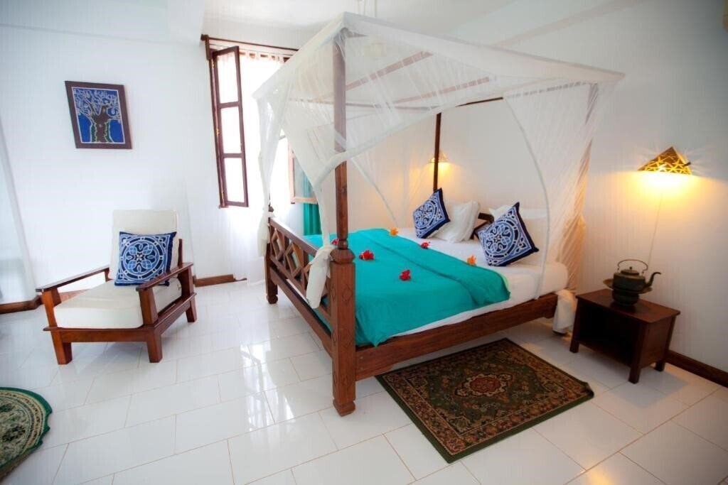 Готель Flame Tree Cottages 3*