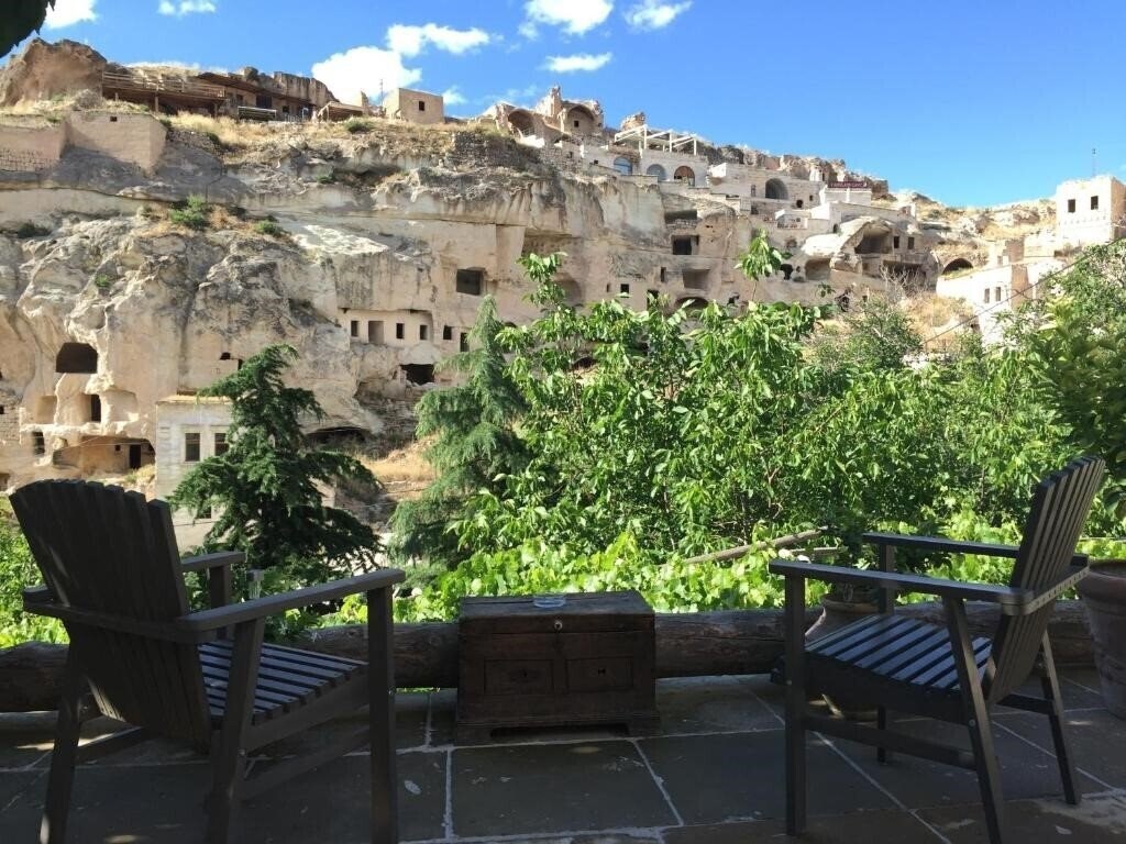 Отель The Village Cave Hotel 4*